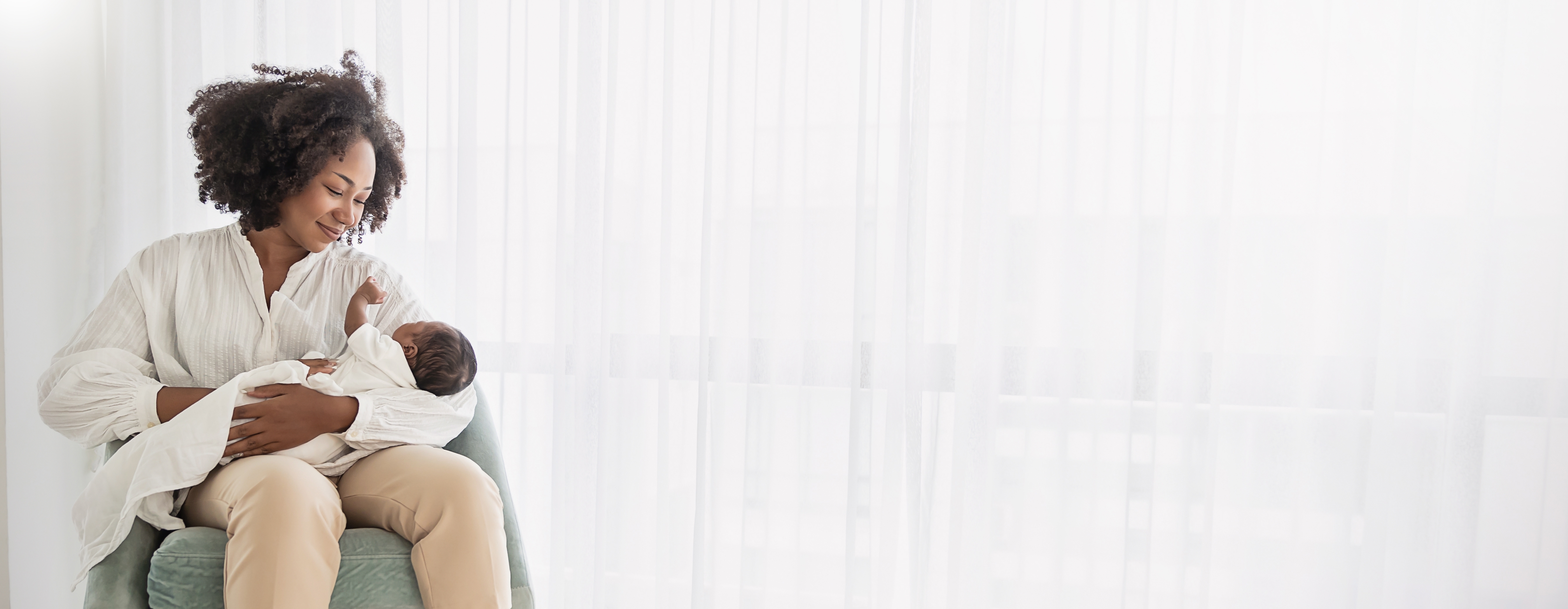 Close,Up,Portrait,Of,Beautiful,Young,African,American,Mother,Holding