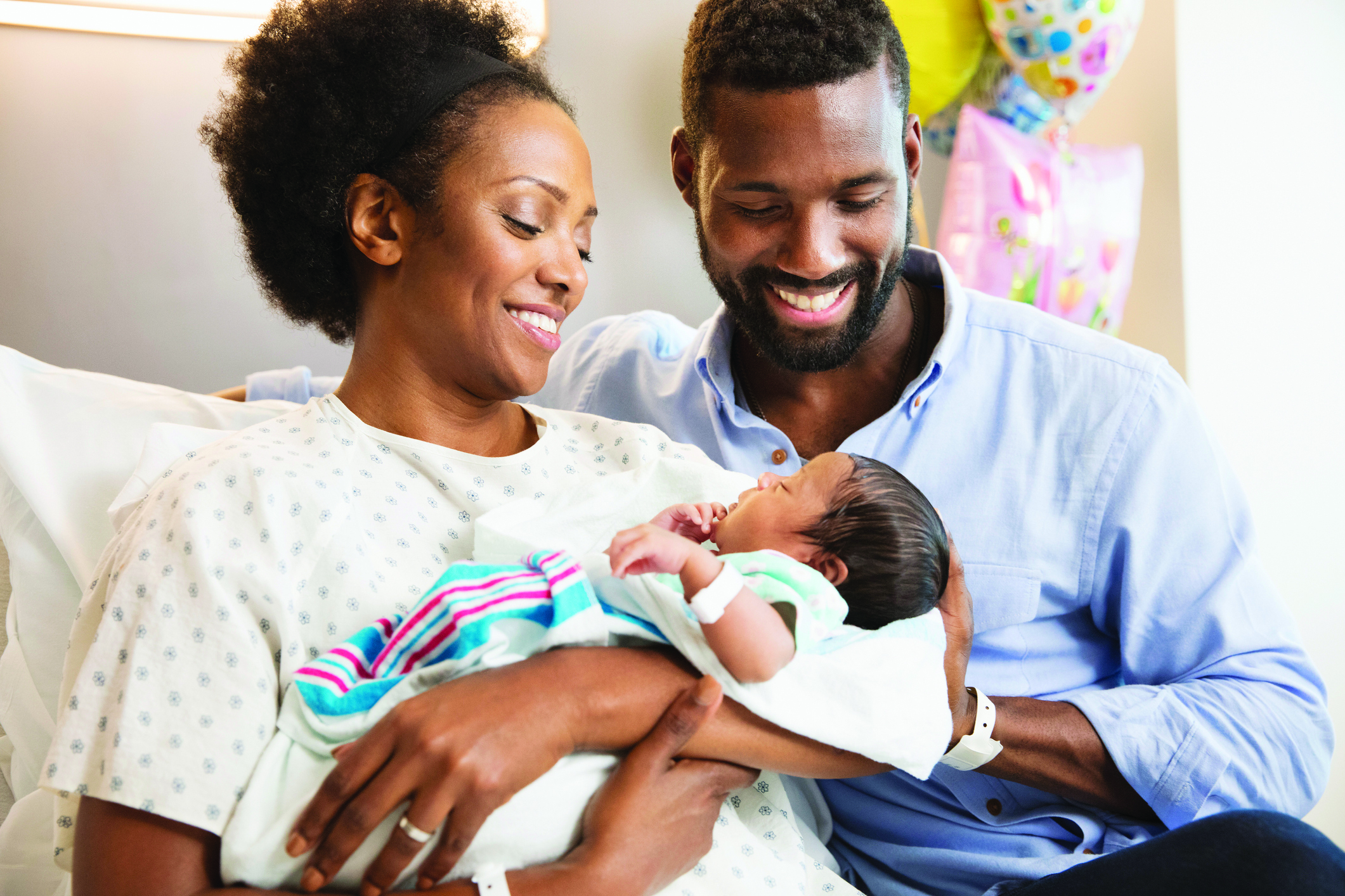 Parents with newborn at hospital room